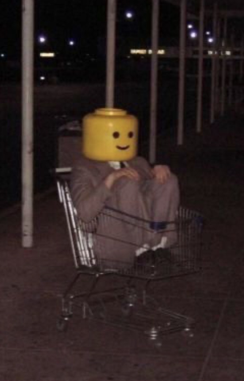 lego man in a shopping cart